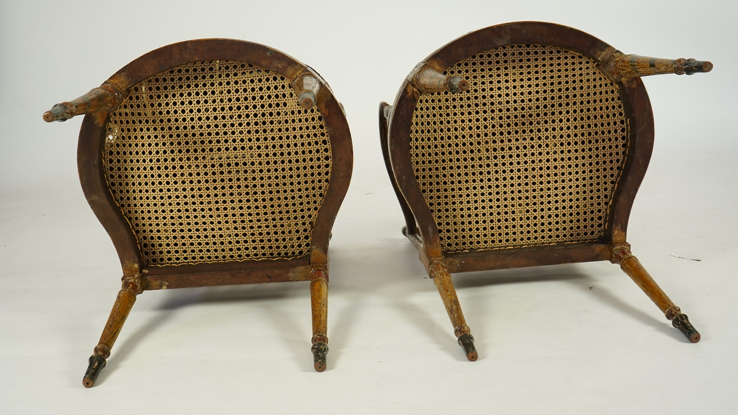 A set of six Sheraton period painted decorated cane seat elbow chairs